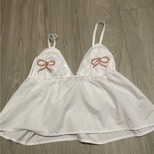Chic White Camisole with Red Bow Details
